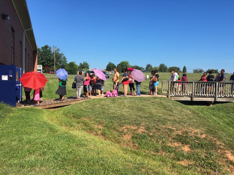 Local families lined up to help collect school supply donations.