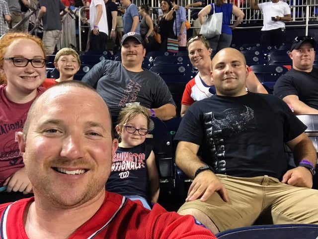 A local firefighter at a baseball game.