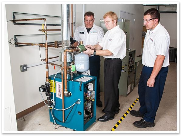 Three F.H. Furr technicians during a training.